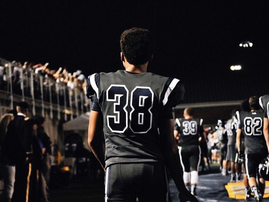 football players leaving field football players leaving field