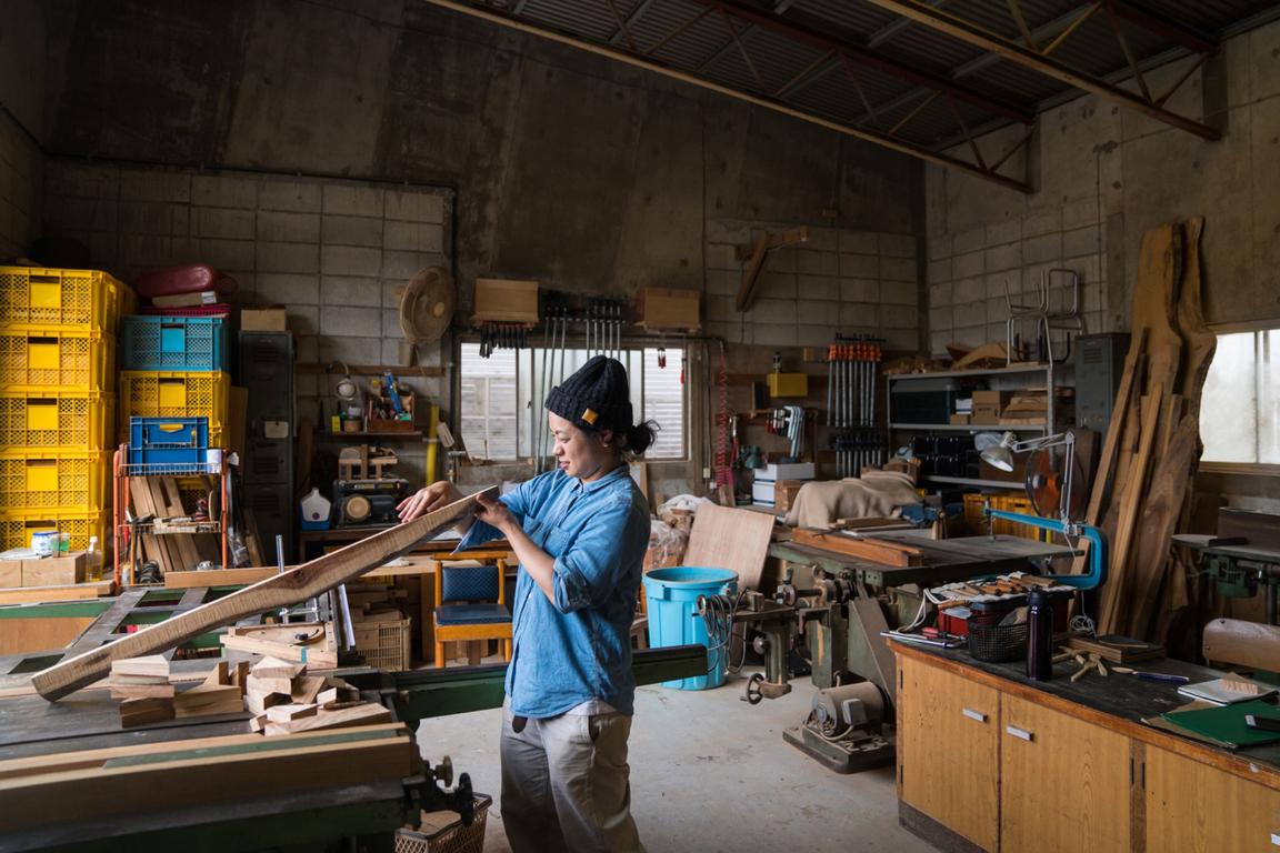 woman working in a wood shop woman working in a wood shop