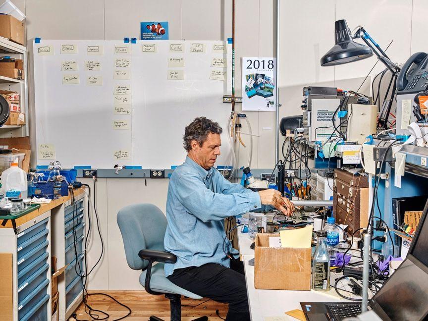 person at engineering work bench person at engineering work bench