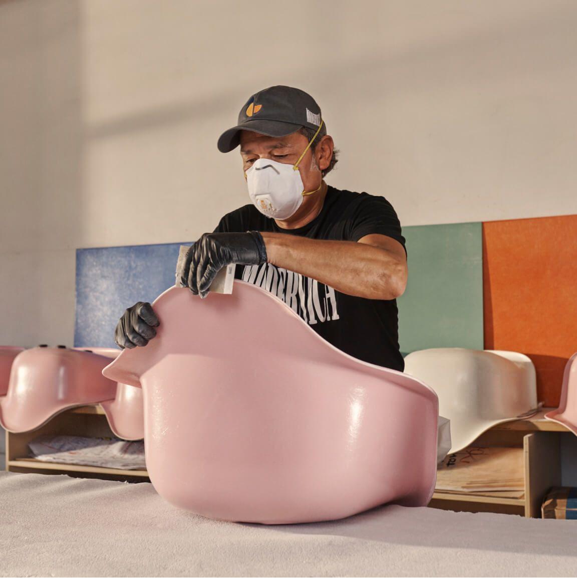 portrait of person crafting fiberglass chairs portrait of person crafting fiberglass chairs