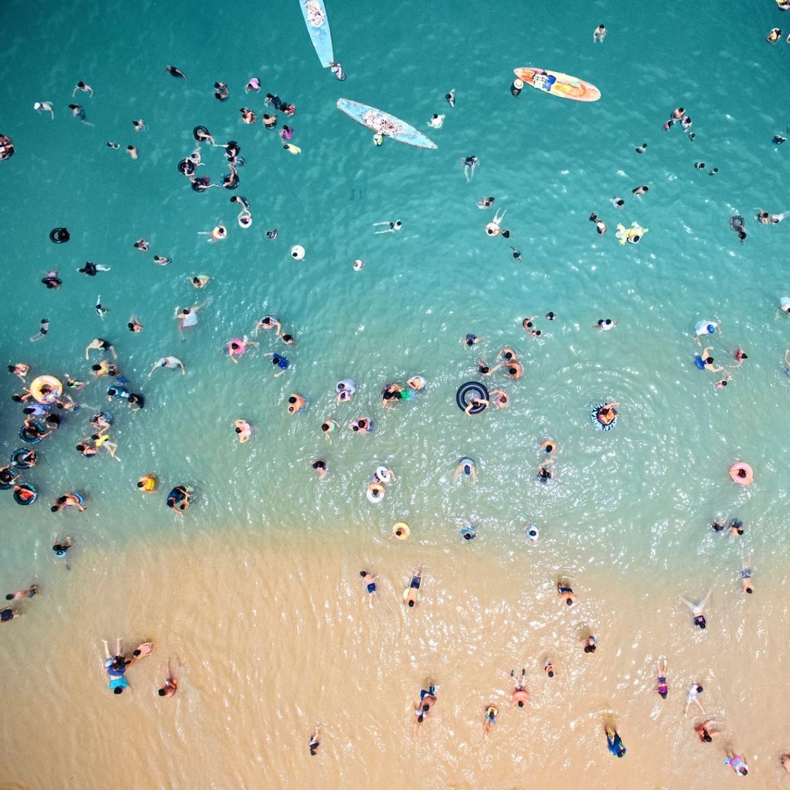 aerial view of people on beach aerial view of people on beach